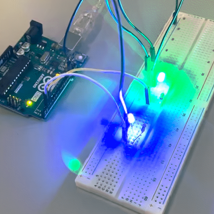 Arduino connected to a breadboard with multiple LED lights and resistors.